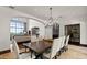 Elegant dining room with chandelier and seating for ten next to wine cellar at 4743 N 54Th St, Phoenix, AZ 85018