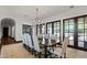Formal dining room featuring a chandelier and dark wood doors leading to the backyard at 4743 N 54Th St, Phoenix, AZ 85018