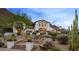Striking home featuring a meticulously landscaped yard, complemented by the scenic mountain backdrop at 4743 N 54Th St, Phoenix, AZ 85018