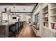 A spacious kitchen featuring a long island with seating, wooden beams, and a cozy window bench at 4743 N 54Th St, Phoenix, AZ 85018