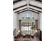 Grand living room featuring large windows, high ceilings, wooden beams, and bright light at 4743 N 54Th St, Phoenix, AZ 85018