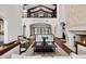 Bright, open living room with high ceilings, balcony, and stone fireplace at 4743 N 54Th St, Phoenix, AZ 85018