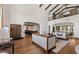 Open-concept living room showcasing kitchen, dining area, balcony, and hardwood floors at 4743 N 54Th St, Phoenix, AZ 85018