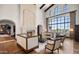 Expansive living room with fireplace, high ceilings, and floor-to-ceiling windows at 4743 N 54Th St, Phoenix, AZ 85018