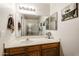 Bathroom with vanity, ample counter space, a large mirror, and a shower at 5055 E Paseo Way, Phoenix, AZ 85044