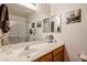 Bathroom with vanity, ample counter space, a large mirror, and a shower at 5055 E Paseo Way, Phoenix, AZ 85044