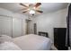 Comfortable bedroom with a large bed, closet space, and tile floors at 5055 E Paseo Way, Phoenix, AZ 85044