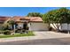 Beautiful single-story home featuring a tiled roof, a well-maintained yard, and an attached two car garage at 5055 E Paseo Way, Phoenix, AZ 85044