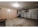Spacious garage features built-in cabinets, providing ample storage space for tools and equipment at 5055 E Paseo Way, Phoenix, AZ 85044