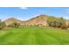 Expansive view of the golf course fairways and desert landscape in a vibrant outdoor setting at 5055 E Paseo Way, Phoenix, AZ 85044