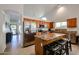 Modern kitchen with stainless steel appliances, granite countertops, and center island with stools at 5055 E Paseo Way, Phoenix, AZ 85044