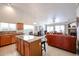 Open-concept living area includes kitchen, dining, and living spaces with lots of natural light at 5055 E Paseo Way, Phoenix, AZ 85044
