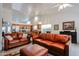 Open-concept living space features a well lit kitchen and comfortable living room seating at 5055 E Paseo Way, Phoenix, AZ 85044