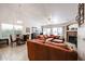 Spacious living room featuring a fireplace, tile floors, and a comfortable seating area at 5055 E Paseo Way, Phoenix, AZ 85044
