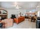 Open-concept living area showcases a fireplace, media center, and access to the kitchen and dining areas at 5055 E Paseo Way, Phoenix, AZ 85044