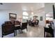 Comfortable living room with dining table, tile floors, and plenty of space for entertaining at 5055 E Paseo Way, Phoenix, AZ 85044