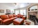 Comfortable living room with a fireplace, natural light and relaxing atmosphere at 5055 E Paseo Way, Phoenix, AZ 85044
