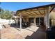 Spacious covered patio with dining set, offering a serene outdoor living space at 5055 E Paseo Way, Phoenix, AZ 85044