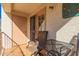 Cozy balcony featuring outdoor seating and a view of stucco exterior and desert landscaping at 5518 E Lindstrom Ln # 2011, Mesa, AZ 85215