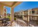 Relaxing balcony with patio furniture overlooking a serene courtyard in a condo complex at 5518 E Lindstrom Ln # 2011, Mesa, AZ 85215