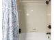 Clean bathroom features a tub with a shower and dark bronze hardware at 5518 E Lindstrom Ln # 2011, Mesa, AZ 85215