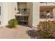 Exterior view of a multi-Gathering residential building with stairs leading to upper-level units at 5518 E Lindstrom Ln # 2011, Mesa, AZ 85215