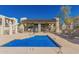 Community pool featuring a partially covered relaxation area with lounge chairs at 5518 E Lindstrom Ln # 2011, Mesa, AZ 85215