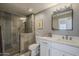 Modern bathroom with a glass-enclosed shower, white vanity, and neutral-tone walls at 7009 E Acoma Dr # 1044, Scottsdale, AZ 85254