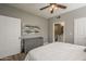 A bedroom showing the bed, a dresser, and doorway into an adjacent bathroom at 7009 E Acoma Dr # 1044, Scottsdale, AZ 85254