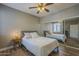This bedroom has a ceiling fan, natural light, and mirrored closet doors, creating a bright and airy space at 7009 E Acoma Dr # 1044, Scottsdale, AZ 85254