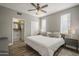 Bedroom features a comfortable bed, large windows, and an en-suite bathroom for added convenience at 7009 E Acoma Dr # 1044, Scottsdale, AZ 85254