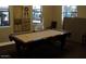 Enjoy the game room's billiard table that is illuminated by natural light from the window at 7009 E Acoma Dr # 1044, Scottsdale, AZ 85254