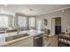 Modern kitchen featuring stainless steel appliances, countertops, and easy access to the living and dining areas at 7009 E Acoma Dr # 1044, Scottsdale, AZ 85254