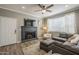 Comfortable living room with a modern fireplace, plush seating, and large windows, perfect for cozy evenings at 7009 E Acoma Dr # 1044, Scottsdale, AZ 85254