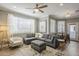 Bright living room featuring a large sectional sofa, stylish decor, and ample natural light, ideal for relaxation at 7009 E Acoma Dr # 1044, Scottsdale, AZ 85254