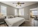 Comfortable main bedroom with a ceiling fan, wood floors, and plenty of natural light at 7009 E Acoma Dr # 1044, Scottsdale, AZ 85254