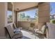 Relaxing outdoor patio with seating area and views of community landscape at 7009 E Acoma Dr # 1044, Scottsdale, AZ 85254