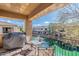 Relaxing balcony space overlooking a serene pond with a grill perfect for outdoor cooking at 705 W Queen Creek Rd # 2158, Chandler, AZ 85248