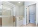 Bright bathroom featuring a glass-enclosed shower, a separate soaking tub, and tiled floors at 705 W Queen Creek Rd # 2158, Chandler, AZ 85248