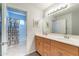 Bathroom with modern vanity and a combined tub and shower behind a patterned curtain at 705 W Queen Creek Rd # 2158, Chandler, AZ 85248