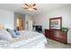 Well-lit bedroom showcasing a large dresser with a mirror and connection to the en-suite at 705 W Queen Creek Rd # 2158, Chandler, AZ 85248