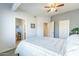 Neutral-toned bedroom with a ceiling fan, carpet, closet, and en-suite bathroom at 705 W Queen Creek Rd # 2158, Chandler, AZ 85248