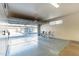Clean two-car garage with epoxy flooring and built-in storage units at 705 W Queen Creek Rd # 2158, Chandler, AZ 85248
