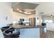 Bright kitchen featuring stainless steel appliances, a breakfast bar, and modern white cabinetry at 705 W Queen Creek Rd # 2158, Chandler, AZ 85248