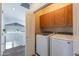 Well-equipped laundry area with modern appliances and ample storage space at 705 W Queen Creek Rd # 2158, Chandler, AZ 85248