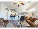 Open-concept living room featuring stylish furnishings and seamless flow to the kitchen at 705 W Queen Creek Rd # 2158, Chandler, AZ 85248
