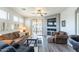 Comfortable living room with a ceiling fan, balcony access, and entertainment center at 705 W Queen Creek Rd # 2158, Chandler, AZ 85248