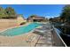 Community swimming pool with lounge chairs and a serene canal view, perfect for relaxing poolside at 705 W Queen Creek Rd # 2158, Chandler, AZ 85248