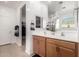 Bright primary bathroom with double sink vanity, with a walk-in closet, and neutral paint scheme at 7093 E Mallard Ct, San Tan Valley, AZ 85143