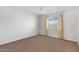 Bright bedroom with ceiling fan, neutral carpet and bright window at 7607 N 22Nd Pl, Phoenix, AZ 85020